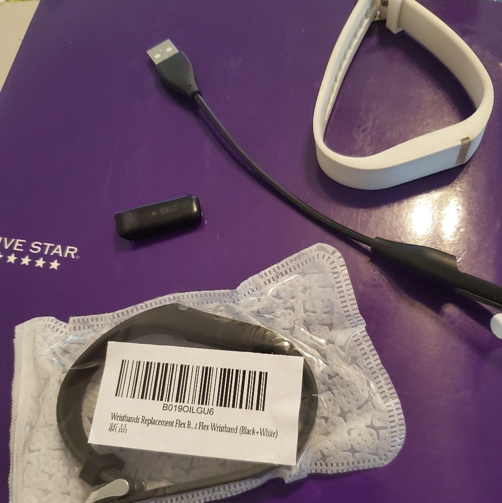 Fitbit with all pieces and two bracelets.